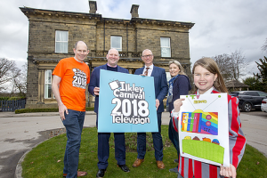 Ilkley Primary pupil posing with her winning Ilkley Carnival design