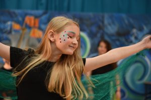 Actress in 'The Tempest' Schools edition acting on stage