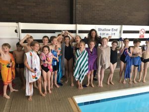 Pupils celebrate their silver trophy win at the inter schools swimming gala