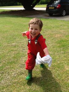 Child running with wet cloth