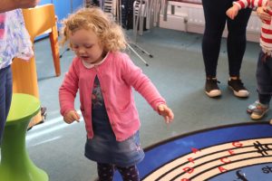 Stay and Play visitor dancing to music