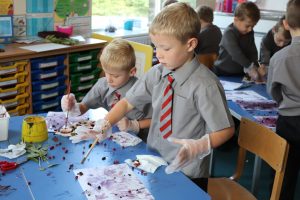 Ghyll Royd School boys paint with juice from berries