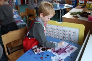 Ghyll Royd School boy paint with juice from berries