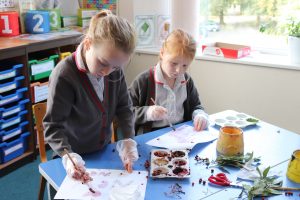 Ghyll Royd School girls paint with juice from berries