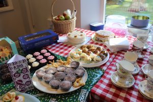 Grandparents' Day and Macmillan Coffee Morning - a table full of cakes and buns donated and ready to raise money