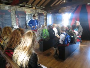 Ghyll Royd School pupils gather around to listen to Crime and Punishment workshop at Henry VII Experience