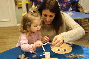 Ghyll Royd School playgroup: mum and toddler making craft owls