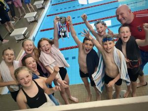 Wharfedale Primary pupils from Ghyll Royd celebrate winning the swimming gala