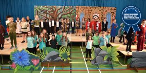 Ilkley Primary pupils at Ghyll Royd School performing on stage in their end of year show