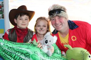 Ghyll-Royd-School’s-Headteacher-David-Martin-with-organiser-Sophie-Barraclough-and-School-Council-Lead-George-Lewis-dressed-as-a-lifeguard-an-animal-and-Crocodile-Dundee.