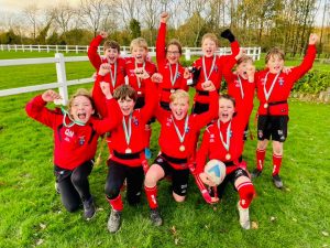 Ghyll Royd rugby team posing with winning medals