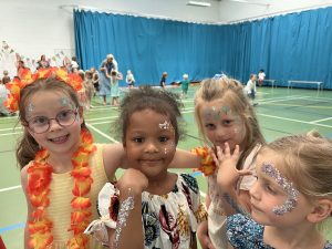 Ghyll Royd pupils show their glitter and temporary tattoos from beach party disco